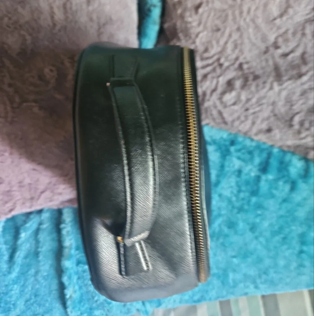 AS-IS Kate Spade black leather backpack LEFT STRAP AT THE TOP TORN. STILL NEW